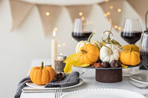 Idea for a beautiful autumn setting for thanksgiving family dinner or wedding. Orange pumpkin